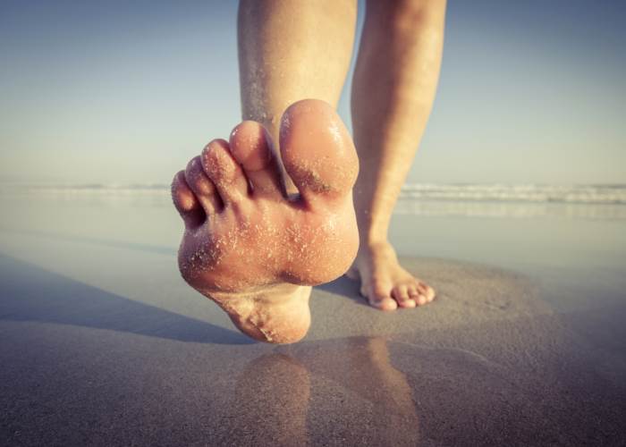 What's the link between flat feet, foot cramps and sore knees?